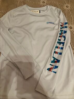 Magellan Outdoors Light Blue Performance Fishing Shirt with Navy Label